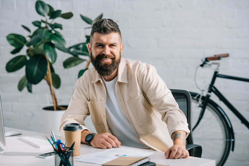bearded businessman sitting in modern office and s 8422dmf
